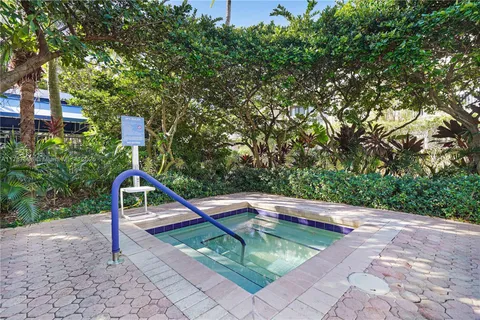 a view of a swimming pool with a yard