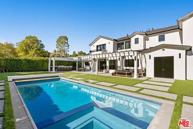 a bedroom with a bed and a television