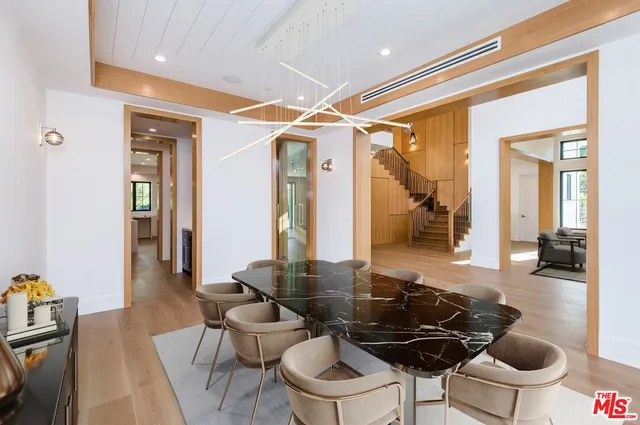 a kitchen with a table and chairs