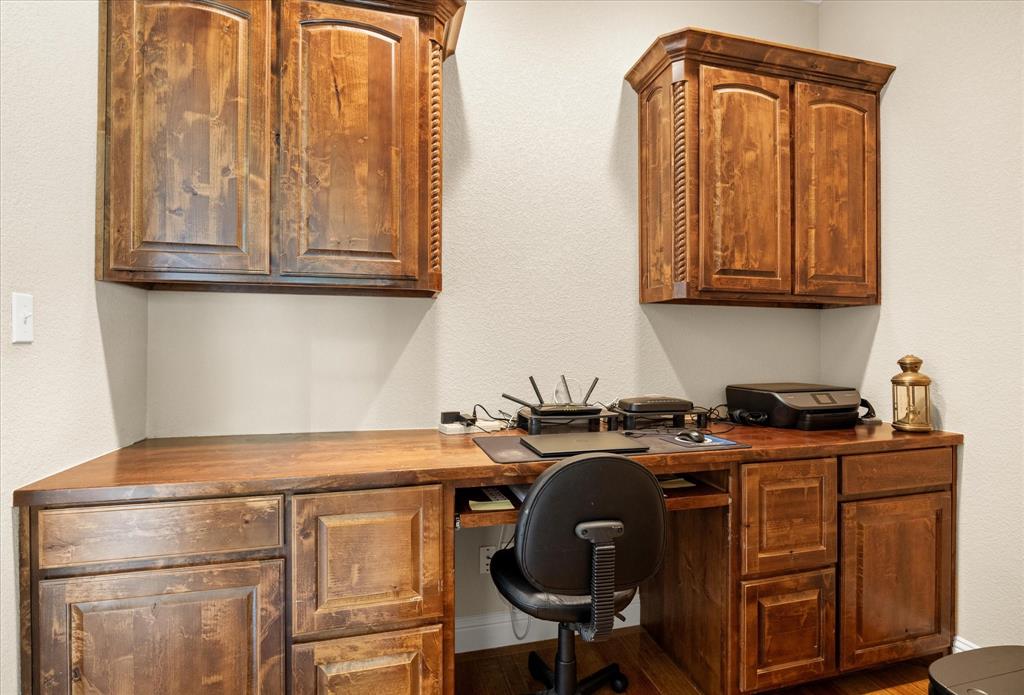 104 Rattling Antler Court Azle, TX 76020 - Photo 22 of 38 Built in office space with custom cabinetry.