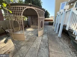 a view of a backyard with sitting area