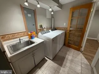 a bathroom with a sink and mirror
