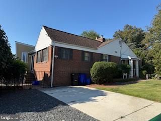 8613 Leonard Drive Silver Spring, MD 20910 - Photo 27 of 27 a front view of a house with a yard and garage