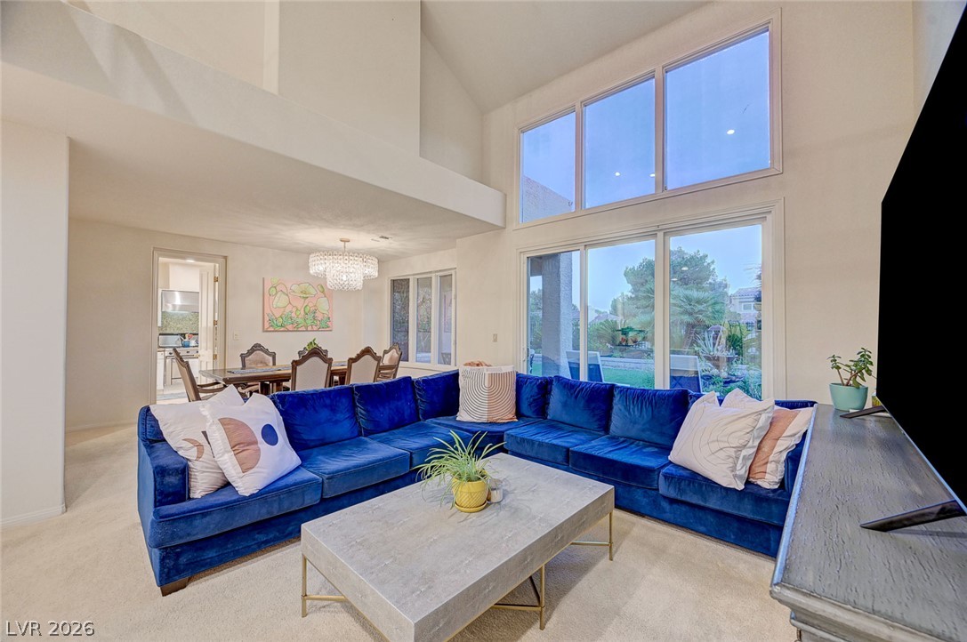 7995 Rio Rico Drive Las Vegas, NV 89113 - Photo 10 of 92 A spacious living area with soaring vaulted ceilings and large windows that flood the room with natural light.