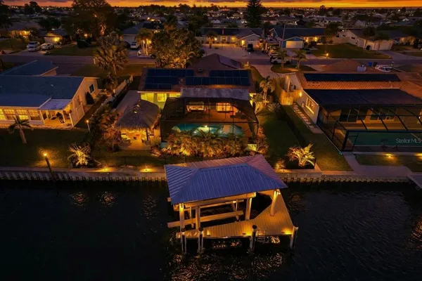 an aerial view of houses with yard