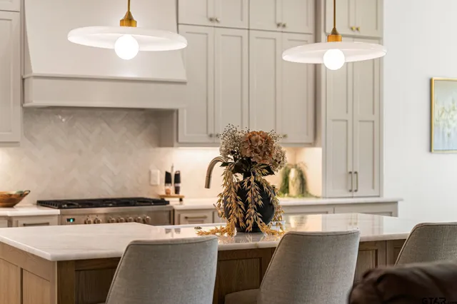 a kitchen with a sink stove and refrigerator