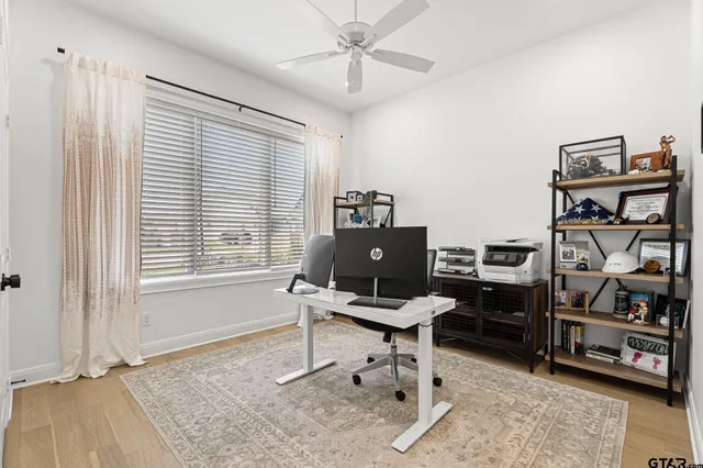 a view of a workspace with furniture