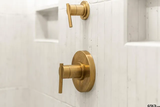 a bathroom with a sink a vanity and a mirror