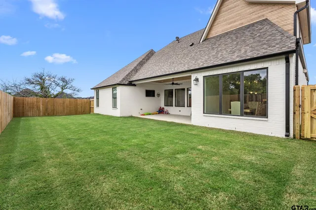 a view of backyard with green space