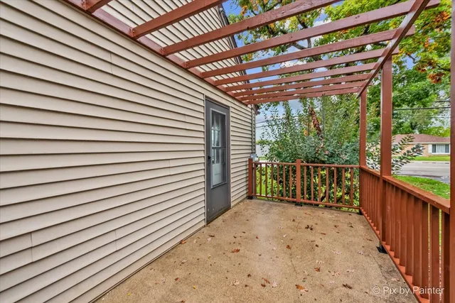 a view of a porch with wooden floor