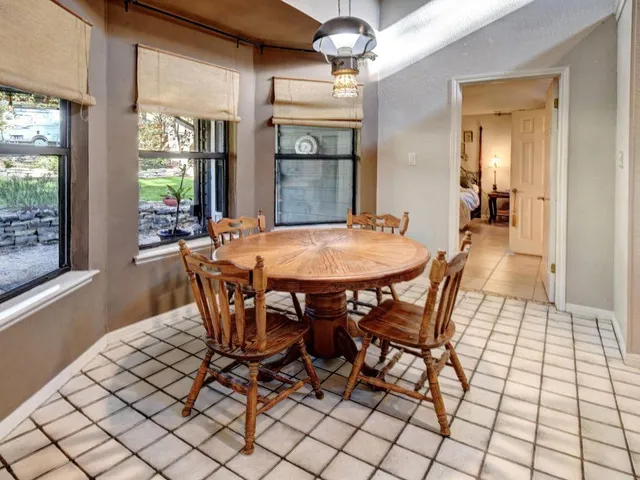 a kitchen with a sink and a stove top oven