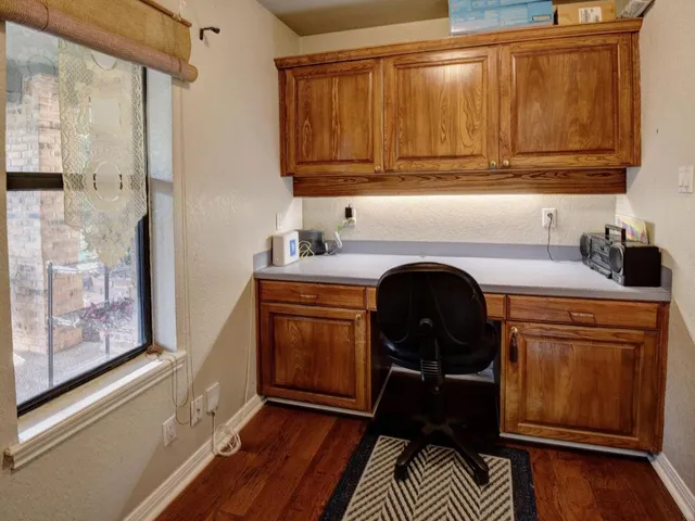 a living room with furniture and large window