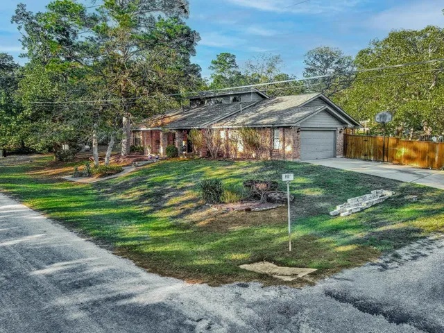 a view of a bedroom with furniture and wooden floor