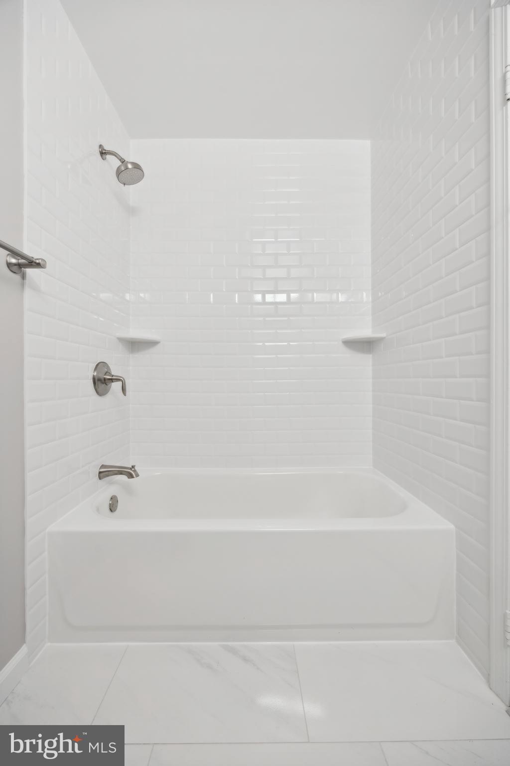 411 Conestoga Road, Unit 27 Devon, PA 19333 - Photo 13 of 15 a bathroom with a bathtub