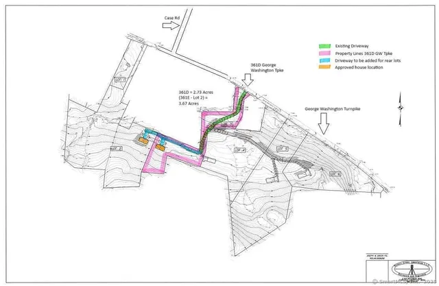 a picture of a room with a white comforter and potted plants