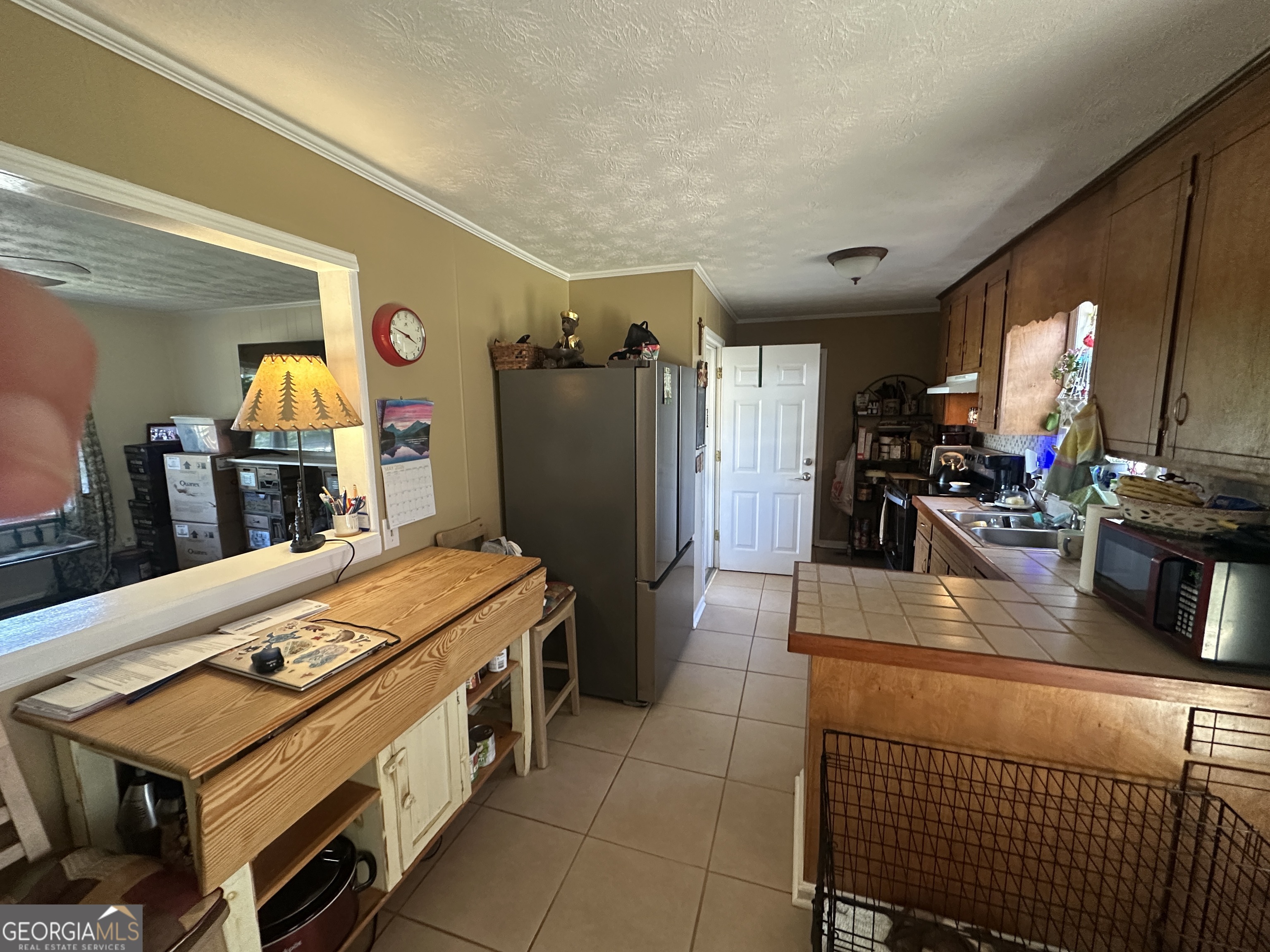 183 Garrison Road Cornelia, GA 30531 - Photo 11 of 27 a kitchen with stainless steel appliances granite countertop a refrigerator a stove and a sink with dishwasher