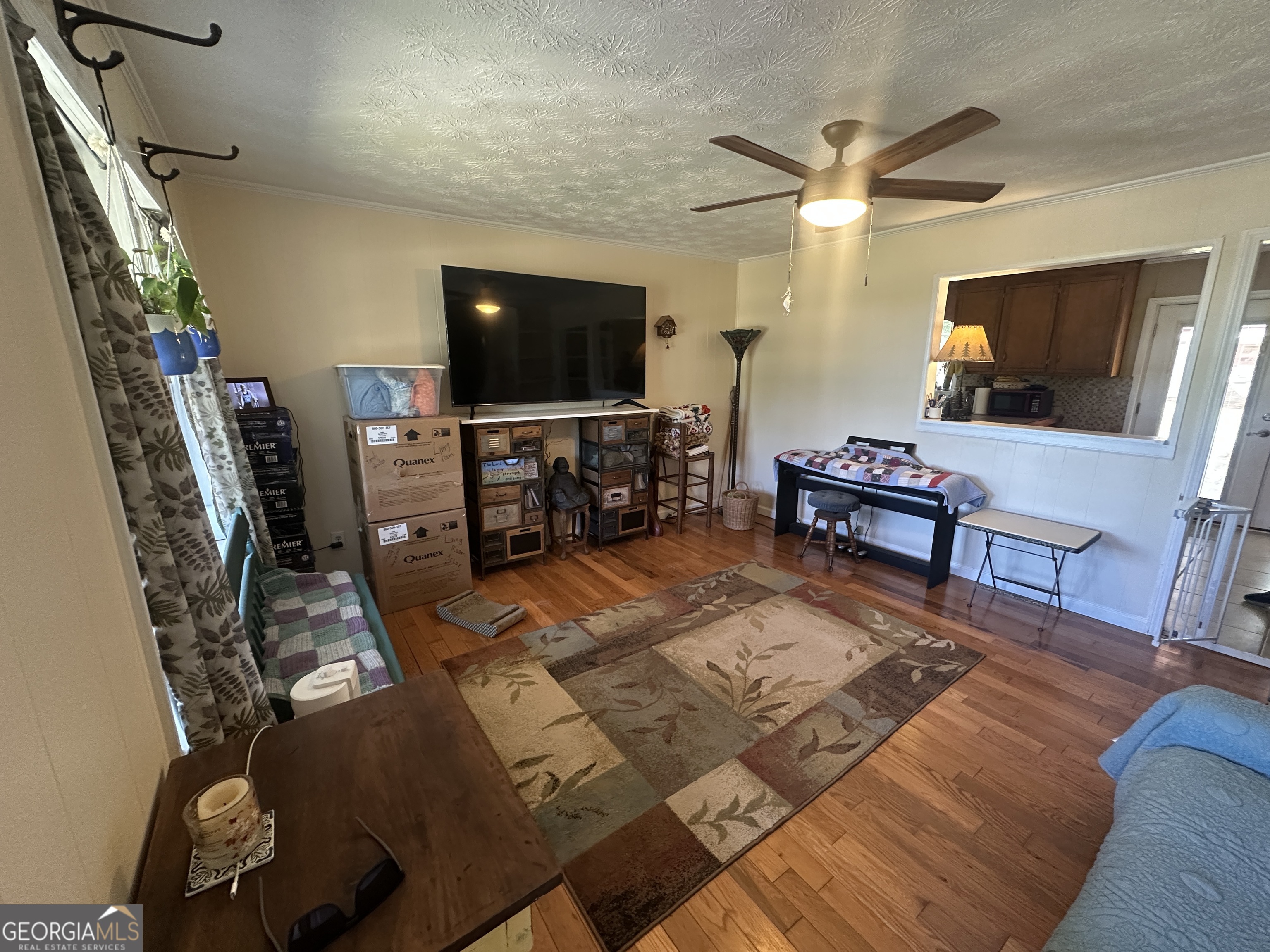 183 Garrison Road Cornelia, GA 30531 - Photo 15 of 27 a living room with furniture and a flat screen tv