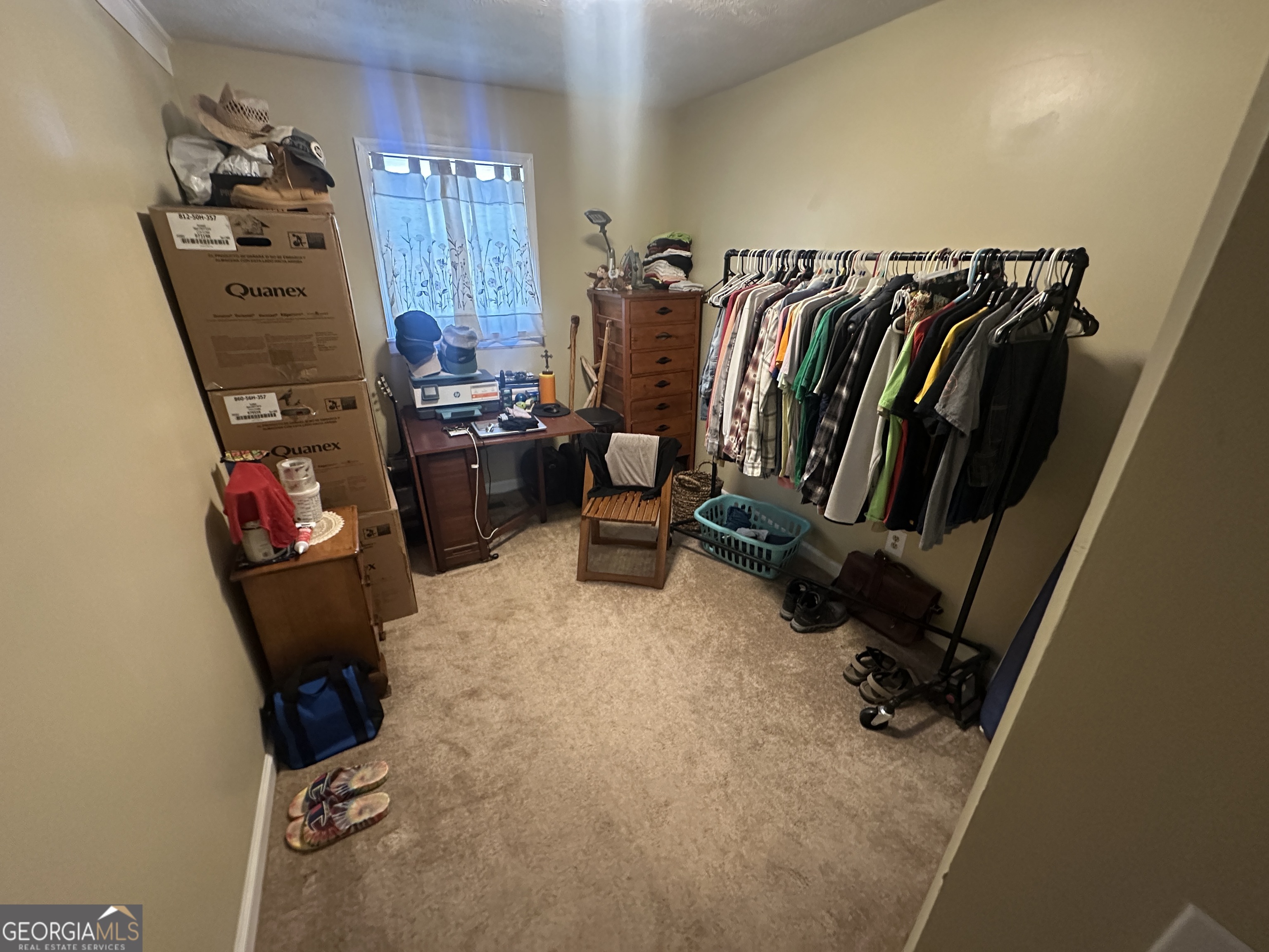 183 Garrison Road Cornelia, GA 30531 - Photo 21 of 27 a view of walk in closet with clothes and shoes
