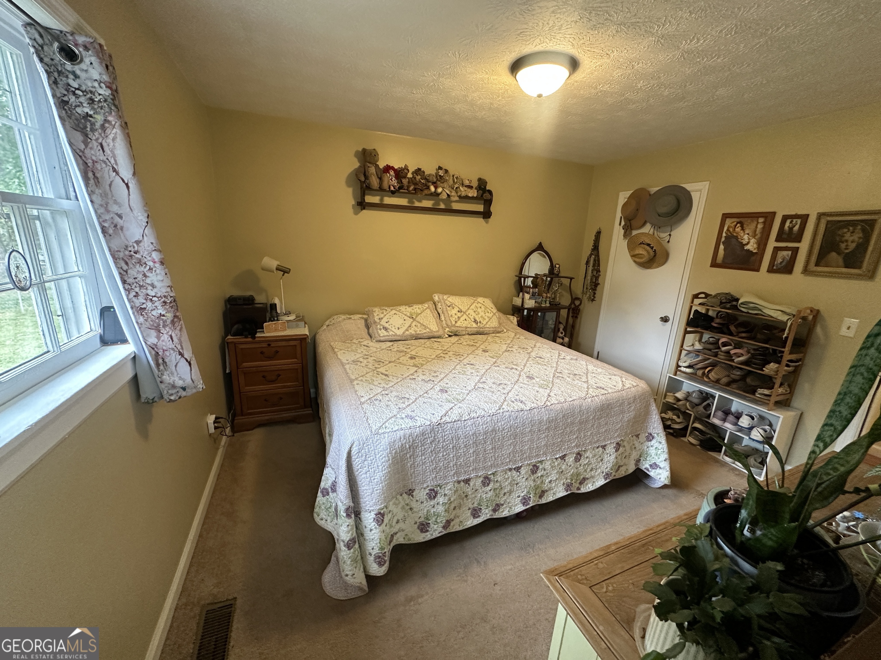 183 Garrison Road Cornelia, GA 30531 - Photo 25 of 27 a bedroom with a bed and a window