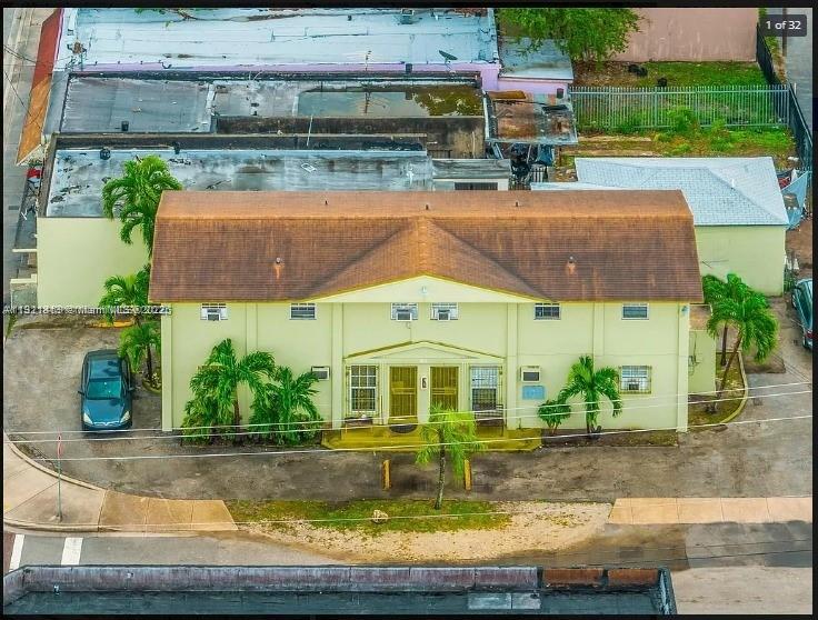 an aerial view of a house with swimming pool