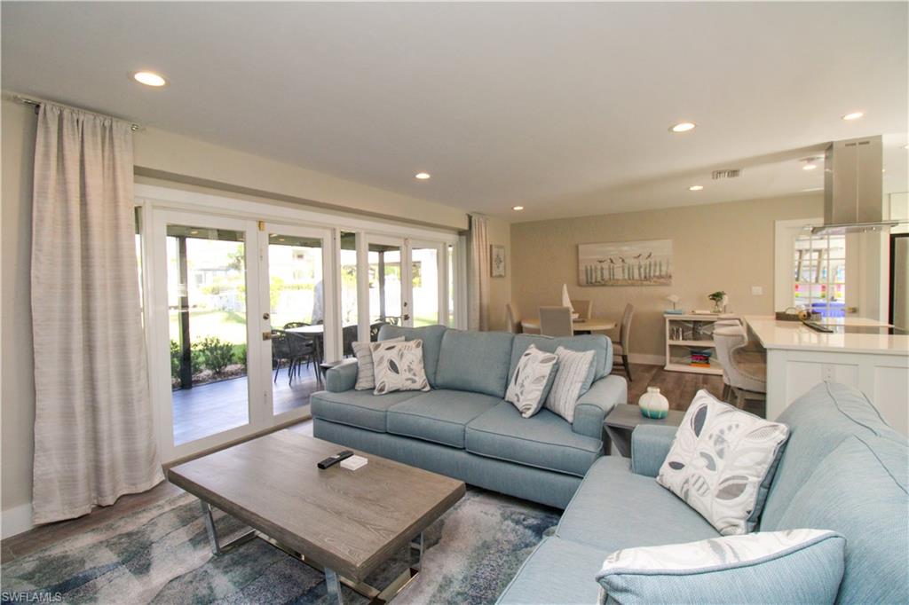 1353 Pelican Avenue Naples, FL 34102 - Photo 13 of 41 a living room with furniture and a large window