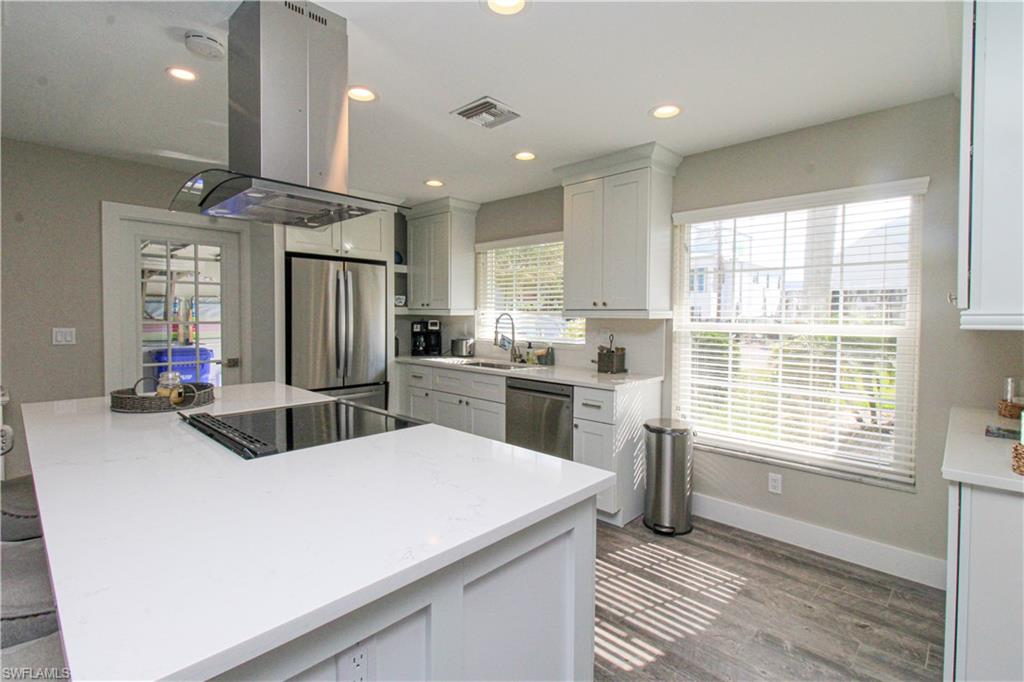 1353 Pelican Avenue Naples, FL 34102 - Photo 20 of 41 a kitchen with refrigerator and window