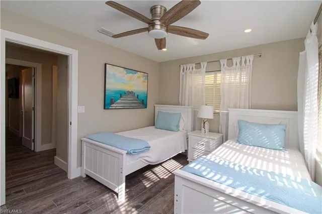 a bedroom with furniture and a window