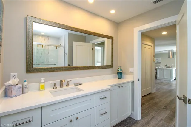 a bathroom with a sink and a mirror