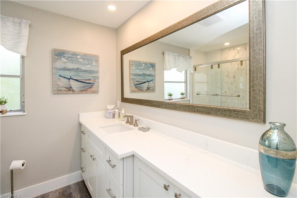 1353 Pelican Avenue Naples, FL 34102 - Photo 36 of 41 a bathroom with a double vanity sink mirror and