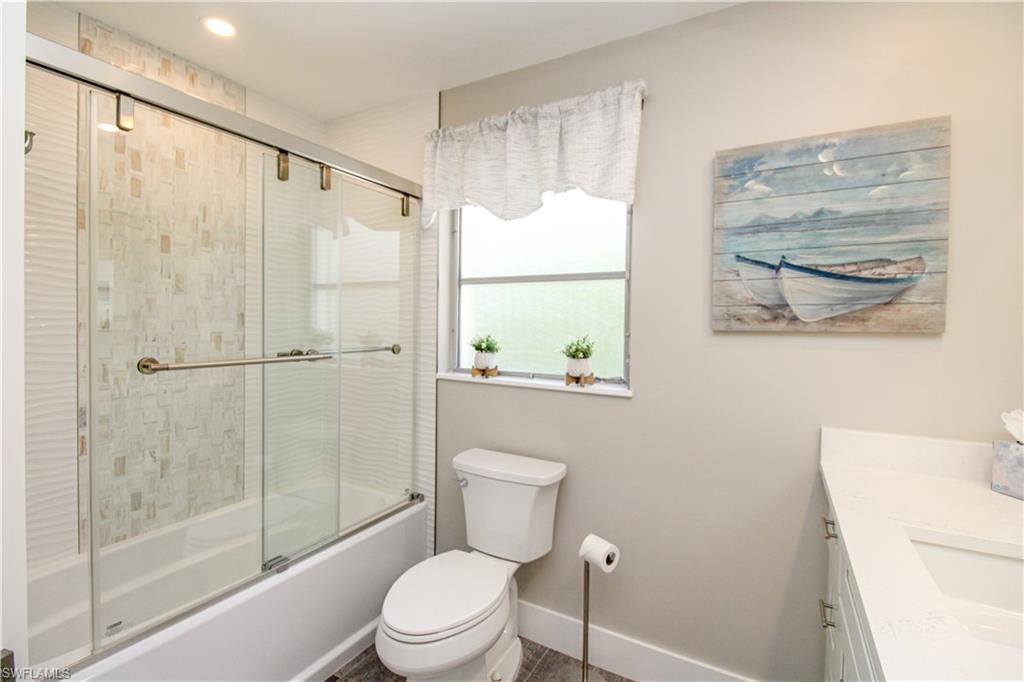 1353 Pelican Avenue Naples, FL 34102 - Photo 37 of 41 a bathroom with a toilet a sink and a shower