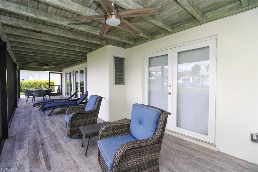 1353 Pelican Avenue Naples, FL 34102 - Photo 8 of 41 a living room with furniture and a wooden floor