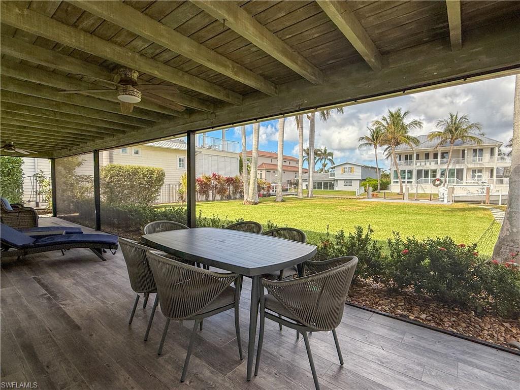 1353 Pelican Avenue Naples, FL 34102 - Photo 9 of 41 a view of a dining room with furniture window and outside view