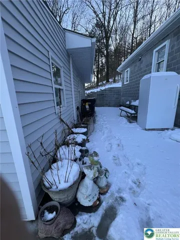 a view of a backyard with furniture