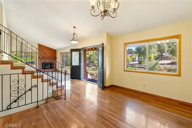 a kitchen with granite countertop a refrigerator and a sink