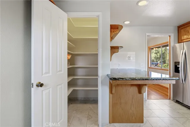 a view of balcony with wooden floor