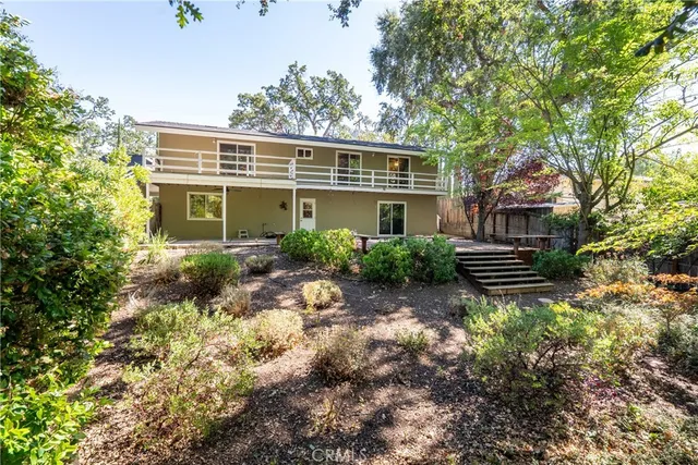 an aerial view of residential house and sandy dunes