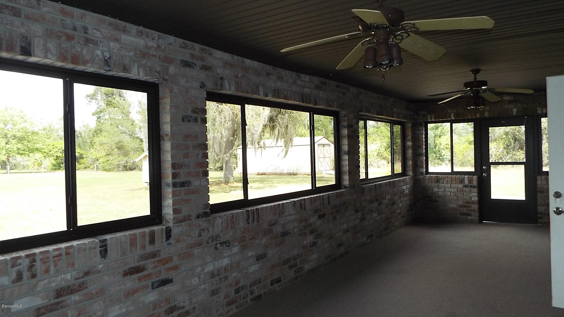 3660 Grant Line Road Mims, FL 32754 - Photo 26 of 28 enclosed back porch