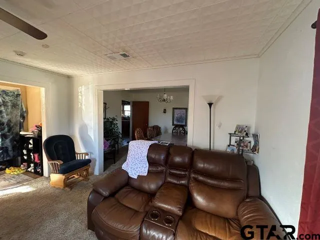 a living room with furniture and a couch