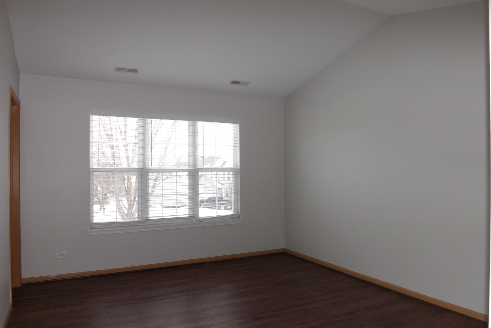 3312 Allen Street Plano, IL 60545 - Photo 12 of 21 an empty room with wooden floor and windows