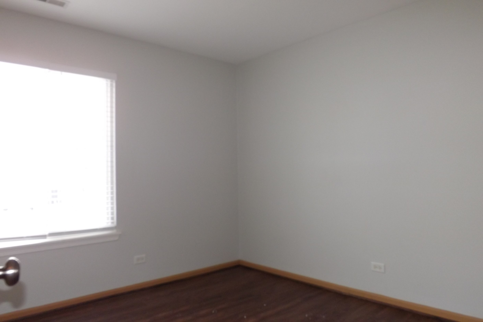 3312 Allen Street Plano, IL 60545 - Photo 14 of 21 a view of a small space with wooden floor and a window
