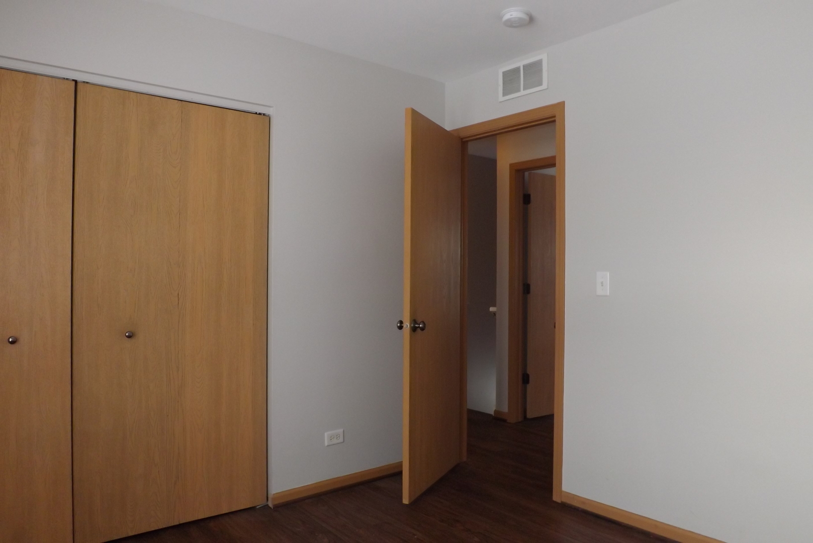 3312 Allen Street Plano, IL 60545 - Photo 15 of 21 a view of a hallway with wooden floor