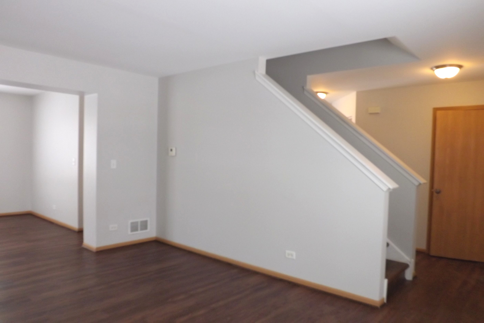 3312 Allen Street Plano, IL 60545 - Photo 2 of 21 a view of a hallway with wooden floor