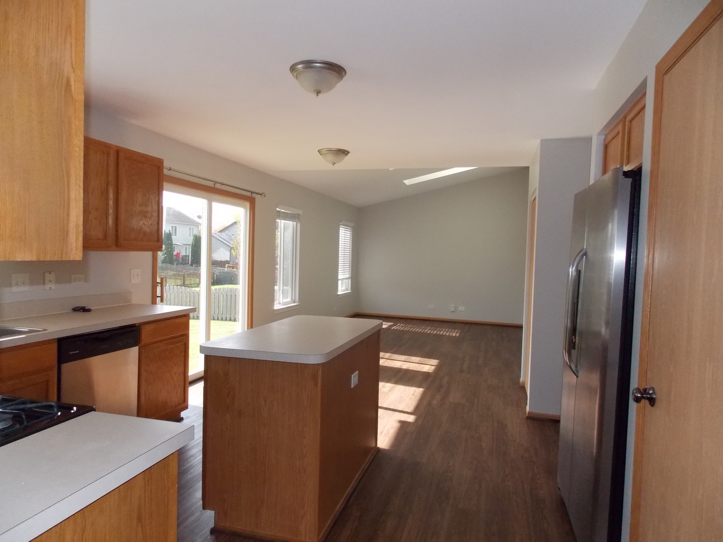 3312 Allen Street Plano, IL 60545 - Photo 8 of 21 a kitchen with stainless steel appliances granite countertop a sink stove and refrigerator