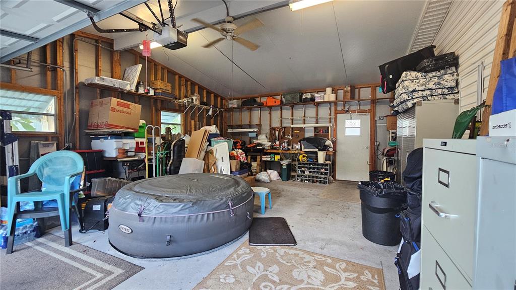 8210 Bull Run Drive New Port Richey, FL 34653 - Photo 20 of 30 a living room with furniture and a chandelier