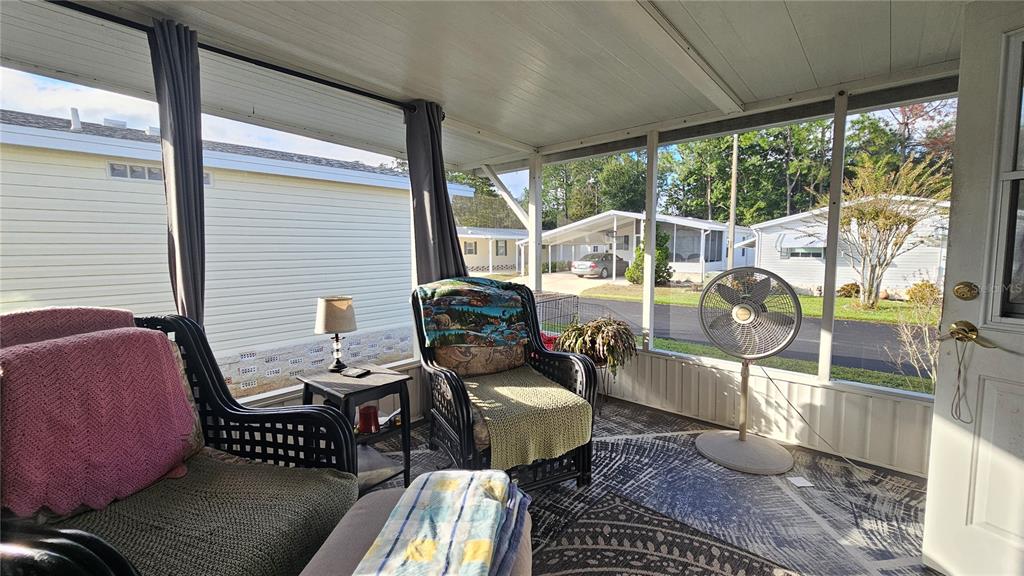 8210 Bull Run Drive New Port Richey, FL 34653 - Photo 21 of 30 a view of a porch with furniture