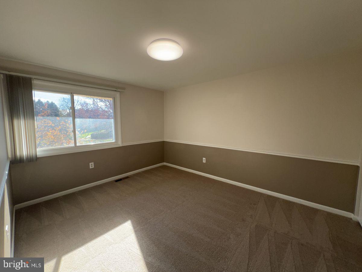1002 Taney Avenue, Unit 1002 Frederick, MD 21702 - Photo 5 of 7 an empty room with a window