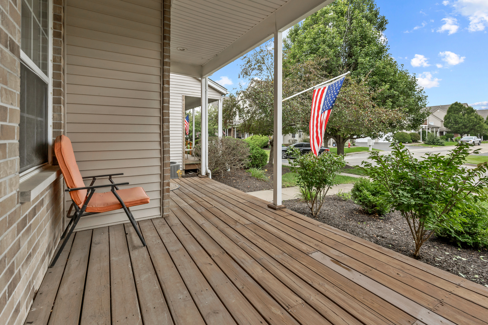 516 Clayton Circle, Unit 516 Sycamore, IL 60178 - Photo 2 of 26 a view of a wooden chairs on the roof deck