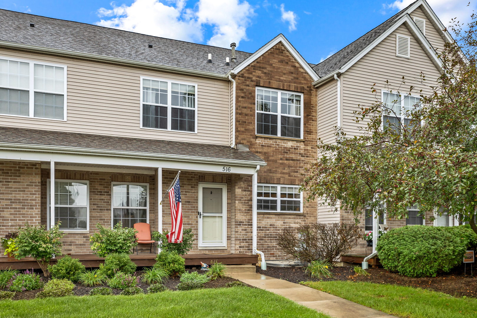 516 Clayton Circle, Unit 516 Sycamore, IL 60178 - Photo 26 of 26 front view of a house with a yard
