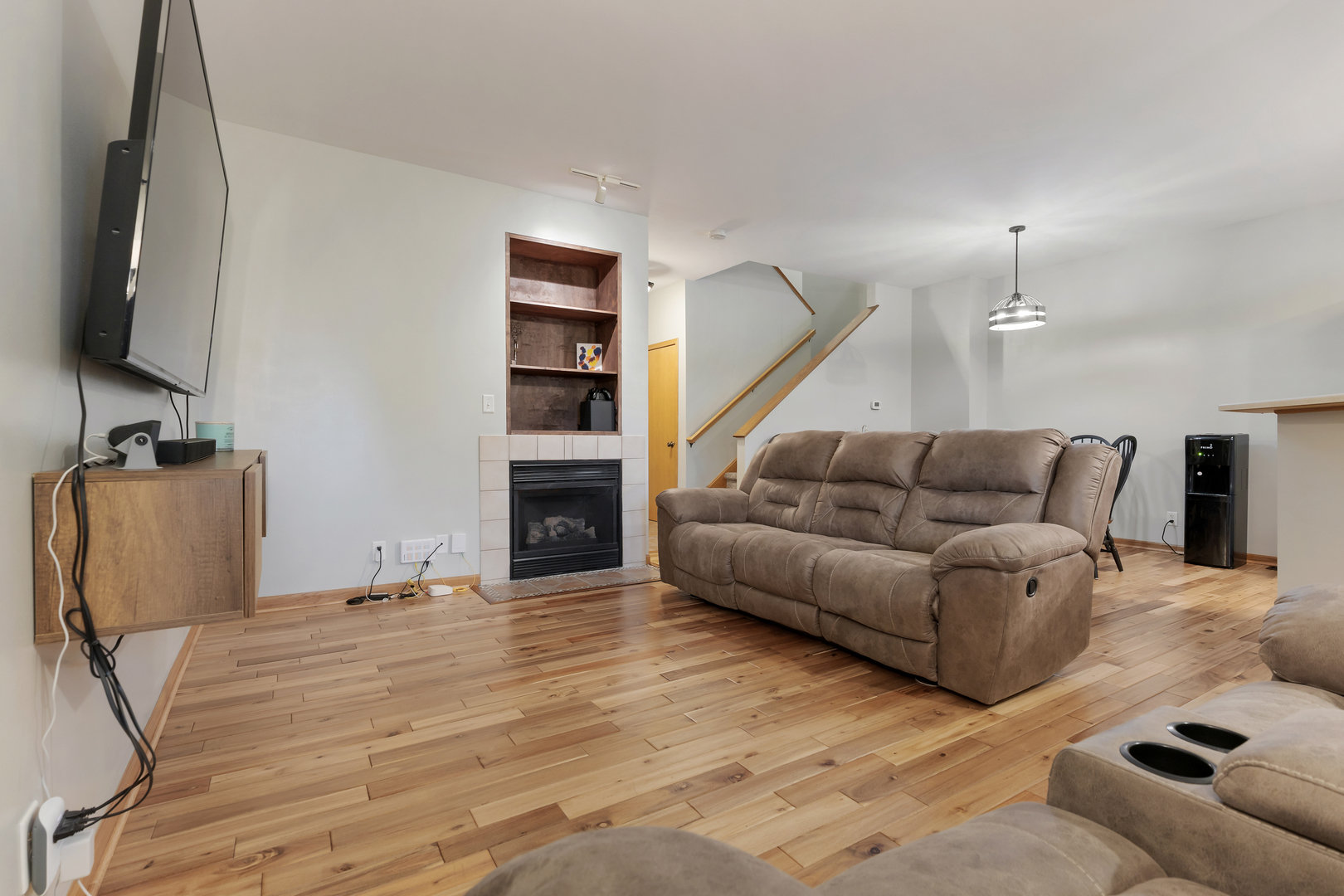 516 Clayton Circle, Unit 516 Sycamore, IL 60178 - Photo 4 of 26 a living room with furniture and a flat screen tv