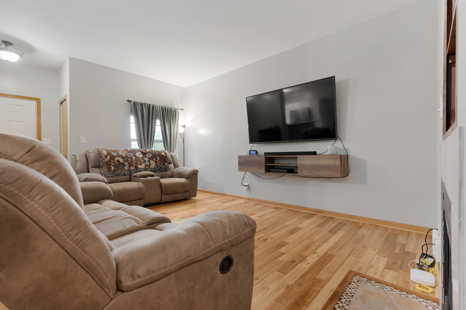 516 Clayton Circle, Unit 516 Sycamore, IL 60178 - Photo 5 of 26 a living room with furniture and a flat screen tv